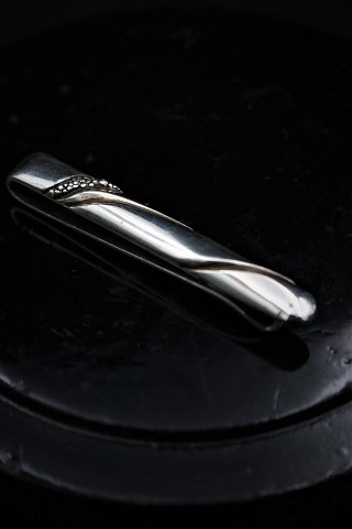 Older tie sole from Georg Jensen in sterling silver. 
Length:6,2cm.