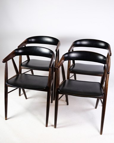 Set of four rosewood chairs in black leather designed by Aksel Bender and Ejnar 
Larsen manufactured by furniture factory Norden in the 1960s.
Dimensions in cm: H: 72.5 W: 52 D: 41 SH: 44
Great condition
