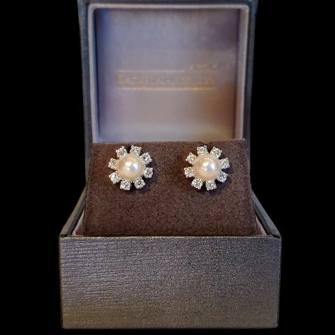 C. Antonsen; Ear rings in 18k white gold set with a pearl and diamonds