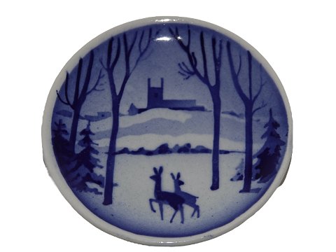 Royal Copenhagen miniature Christmas plate 
Deer in front of castle