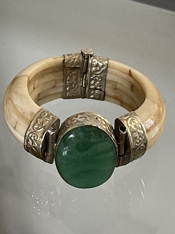 Vintage, ethnic bangle of bone (camel or cow) from the Middle Stone or India 
with large green stone and mounting of white metal / silver
