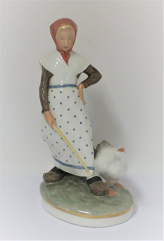 Royal Copenhagen. Porcelain figure. Goose girl in colors. Model 528. Height 18.5 
cm. (1 quality)