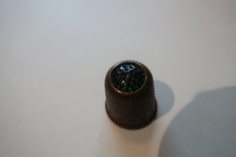 Old thimbles made of brass
With a greenfluss
Decoration in the brass as well