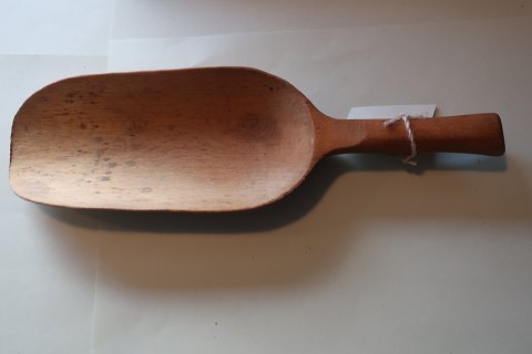 An old spoon made of wood  from the old grocer