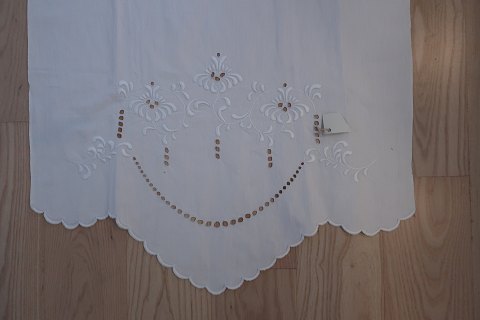 Parade piece
A beautiful old parade piece with handmade white  embroidery with signature
The parade piece was in the good old days used to hang in front of the tea 
towels so that all things always looked clean
121cm x 62cm
The antique linen is our spe