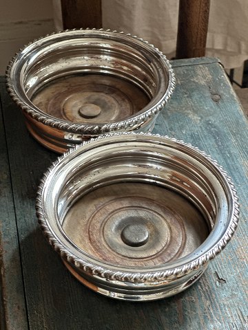 Pair of beautiful, silver plated Danish wine trays / coasters made with wooden 
bases. Stamped as silver plated.