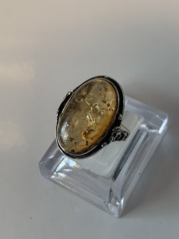 Silver ladies ring with an amber colored stone
stamped 925S
Size 57