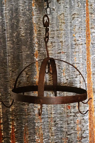 Antique wrought iron frame decorative in the country kitchen for hanging 
cookware on...