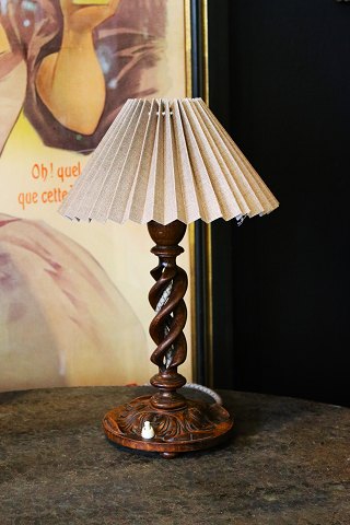 Old English table lamp in dark carved, twisted wood with pleated fabric 
lampshade in linen fabric...