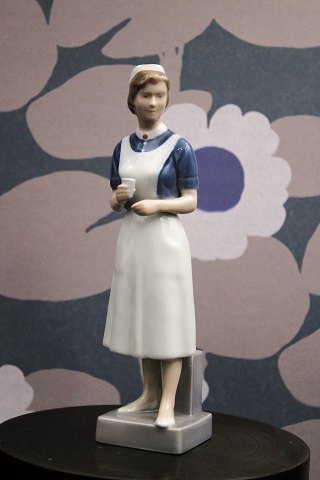 Royal Copenhagen porcelain figure of nurse.
RC#4507...
