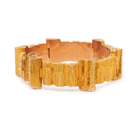 14kt gold Lapponia bracelet by Bjørn Weckström. 
Dated 1972. W: 1,8cm. L: 18,5cm