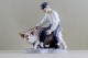 Rare Royal Copenhagen figurine, farmer with pig. 
Decoration number 848.