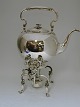 Lundin Antique 
presents: 
Hot water 
kettle and 
burner.
Silver (830) 
made by 
Samuel Prahl