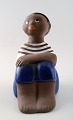 Mari Simulson, Upsala-Ekeby.
Signed. Figure of boy.