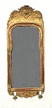 Aabenraa 
Antikvitetshandel 
presents: 
Gilded 
mirror, with 
candle holder, 
Sweden