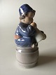 Royal Copenhagen Figurine of a Boy on barrel with a horn No 3689