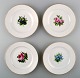 4 antique Royal Copenhagen flat plates in flora danica style.
