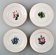 4 antique Royal Copenhagen flat plates in flora danica style.
