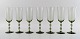 SIMON GATE FOR ORREFORS, A set of seven smoky champagne art glasses.