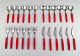 Complete service for 6 p., Henning Koppel. Strata cutlery in stainless steel and 
red plastic. Manufactured by Georg Jensen.