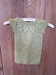 Sweaterdress 
An old handmade sweaterdress for the child
We have a large choice of old/antique cloth for 
children/baby, bed clothes etc.