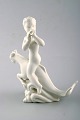 Harald Salomon for Rörstrand, blanc de chine / white glazed figure of a fawn 
riding on fabel creature.