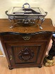 Console Cabinet 
in mahogany.
with relief of 
fruit on ...