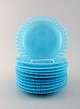 11 Swedish design plates in turquoise art glass. Pierced edge.