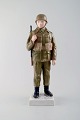 Bing & Grondahl / B&G figure in porcelain, soldier/gunner in combat uniform. # 
2444.