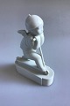 Royal Copenhagen Figurine, Cupid on scooter No 12477