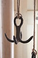 1800 Century wild hook in wrought iron, super decorative  to hang old cookware 
or garlic bunches on.
Is fitted with an old strong rope so it