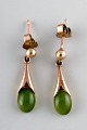 Danish 8K gold ear studs with green stones. Mid-1900s.
