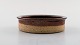 Helle Allpass (1932-2000). Low bowl of raw and glazed stoneware in brown shades. 
1960 / 70