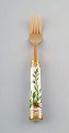 Michelsen for Royal Copenhagen. "Flora Danica" lunch fork made of gold plated 
sterling silver. Porcelain handles decorated in colors and gold with flowers.