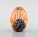 Monica Backström for Kosta Boda, Sweden. Eggs in clear mouth blown art glass 
decorated with orange stripes.