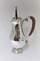 Lundin Antique 
presents: 
Georg 
Jensen. 
Chocolate jug 
with stirrer. 
Sterling (925). 
Model 460B. 
Design Georg 
Jensen