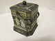 Biscuit-box/Can, made of metal, with a lid and a 
handle
4-/8-edged can
H: 16,5cm
W: 12cm
Condition good compared with the age