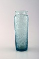 Lalique vase in light blue art glass with floral decoration. 1950