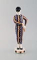 Rasmus Harboe (1868-1952) for Alumina. Rare harlequin porcelain figurine. 
Designed in 1906.