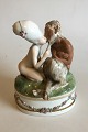 Danam Antik 
presents: 
Royal 
Copenhagen 
Gerhard Henning 
Overglaze 
figurine Faun 
and Nymph No 
1119