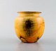 Svend Hammershøi for Kähler, Denmark. Vase in glazed stoneware. Beautiful yellow 
uranium glaze. 1930 / 40