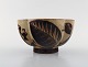 Nils Thorsson for Royal Copenhagen. Jungle series. Bowl in glazed
chamotte clay decorated with palm trees. 1930 / 40