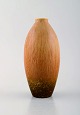 Carl Harry Stålhane for Rörstrand. Vase in glazed ceramics. Beautiful glaze in 
light brown and red shades. Mid 20th century.