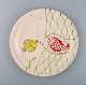 Stig Lindberg for Gustavsberg. "Löja" plate. Hand painted with fish motifs. 
1950