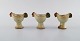 Lisa Larson for Gustavsberg. Three glazed ceramic egg cups from the "Easter" 
series designed as hens. Dated 1982.
