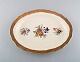 Royal Copenhagen serving dish in porcelain with floral motifs and gold border. 
Mid 20th century.
