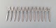 Twelve Georg Jensen "Cactus" pastry forks in sterling silver.
