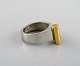 Micke Berggren, Sweden. Modernist designer ring in pewter and brass. Late 20th 
century.
