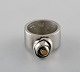 Micke Berggren, Sweden. Modernist ring in pewter and brass. Late 20th century.
