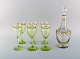 Emile Gallé (1846-1904). Six early and rare wine glasses and carafe in 
mouth-blown light green art glass with hand-painted gold decorations in the form 
of leaves. Museum quality, 1870s / 80s.
